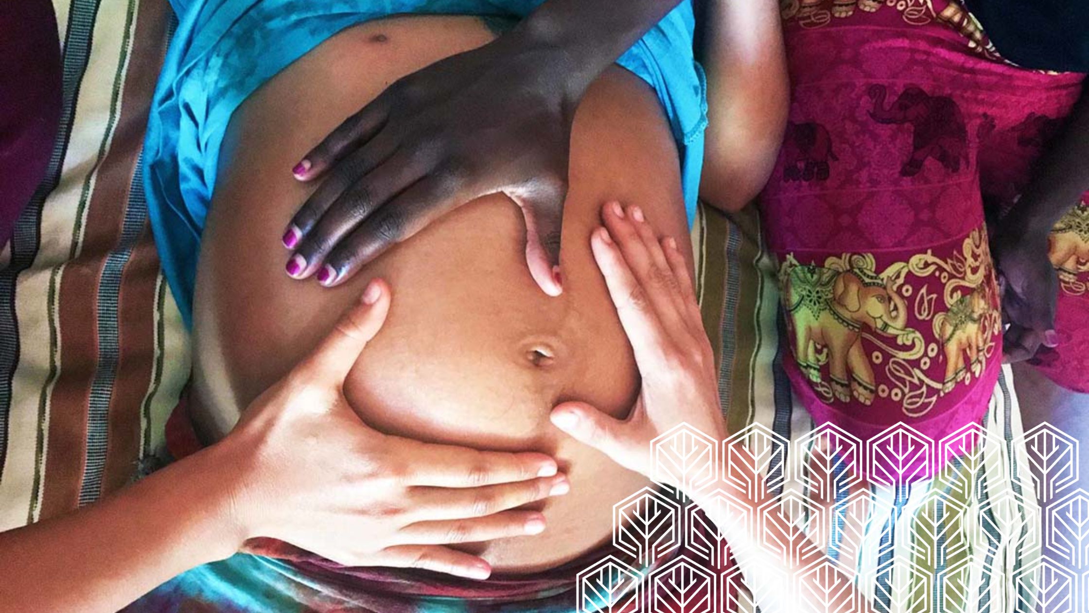 three hands holding pregnant belly