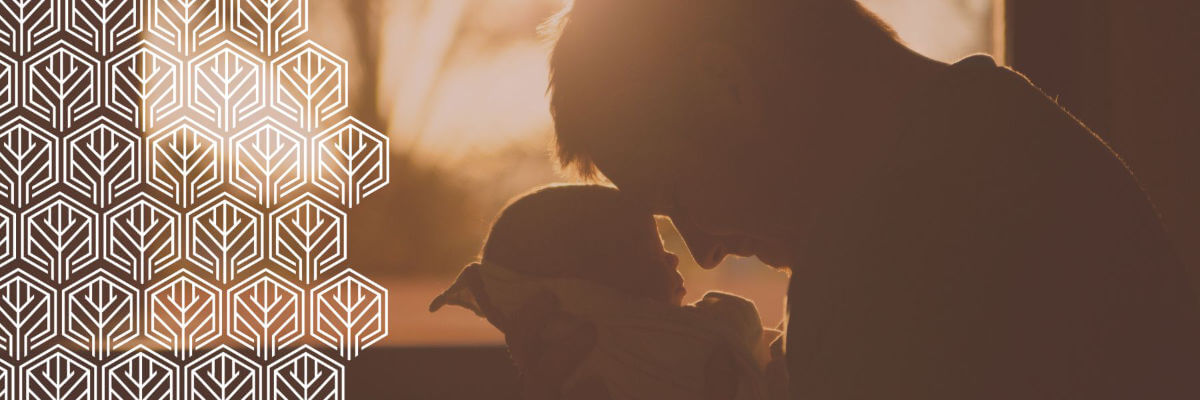 a father holding a baby
