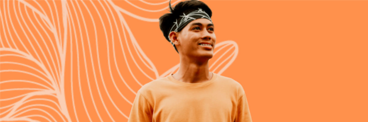 a side view angle photo of a smiling man